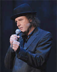 Steven Wright performing for his special When the Leaves Blow Away